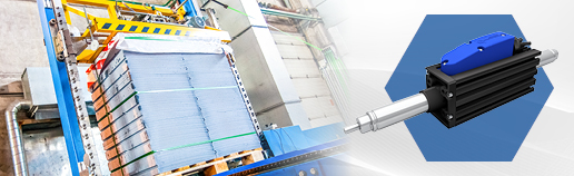Electric linear actuator used in high‑speed automated packaging machinery for stacking and moving boxed goods on a production line.